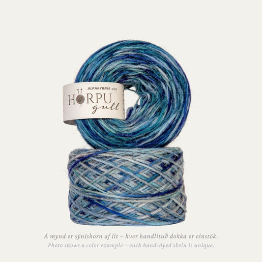 Hand-dyed Icelandic lopi yarn inspired by alpine sea holly in cool blue tones with a natural grey base
