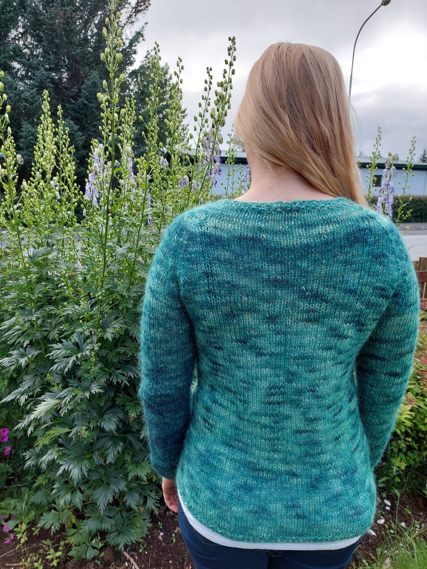 Bergur hiking sweater knitted with Icelandic lopi yarn shown from the back in natural outdoor setting