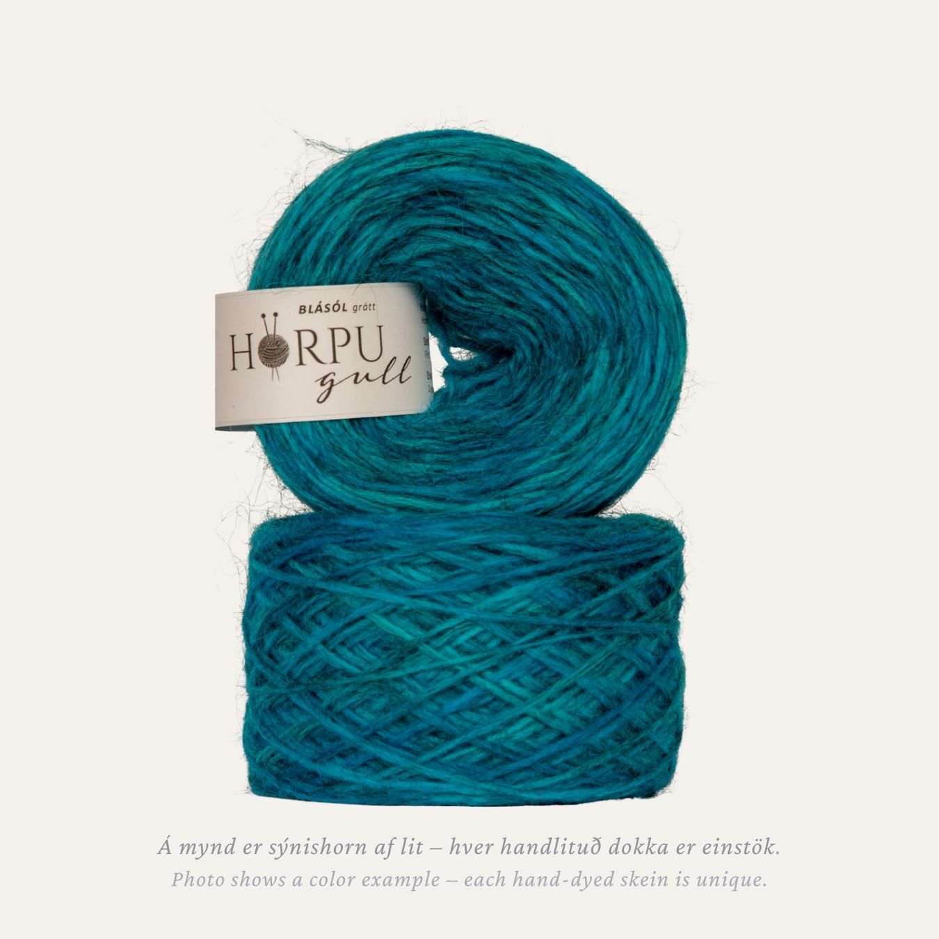 Hand-dyed Icelandic lopi yarn inspired by Bailey’s blue poppy in bright blue tones with a natural grey base
