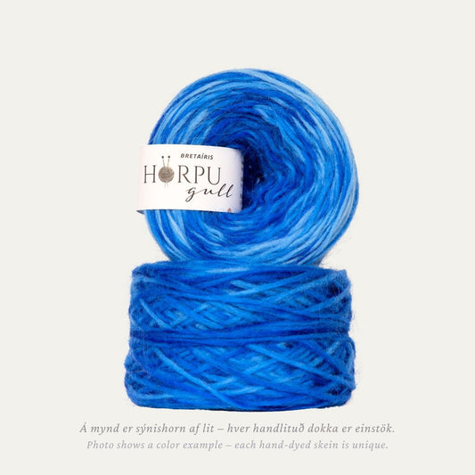Hand-dyed Icelandic lopi yarn in deep vibrant blue tones inspired by iris flowers
