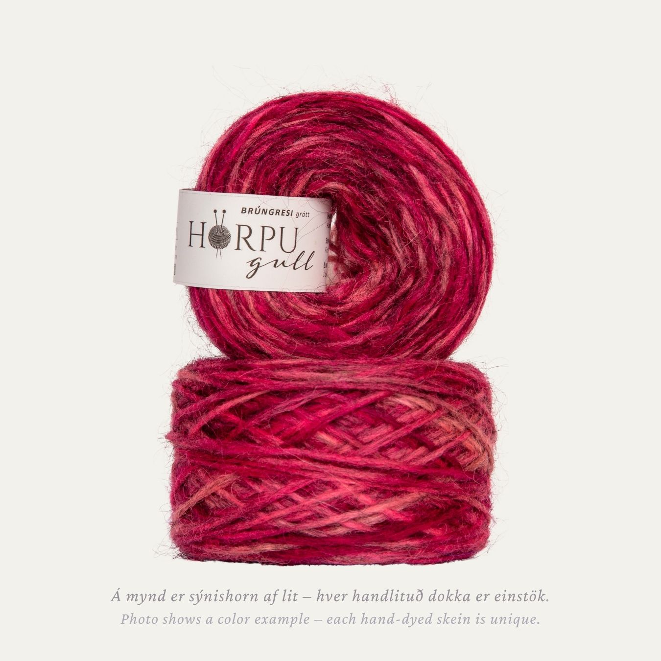 Hand-dyed Icelandic lopi yarn inspired by dusky crane’s-bill in rich pink and red tones with a natural grey base