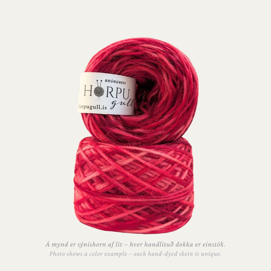 Hand-dyed Icelandic lopi yarn inspired by dusky crane’s-bill in rich pink and red tones