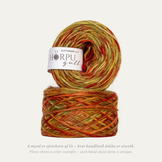 Hand-dyed Icelandic lopi yarn inspired by crevice alumroot in warm earthy tones with a natural grey base