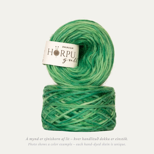 Hand-dyed Icelandic lopi yarn in soft fresh green tones inspired by lily of the valley leaves