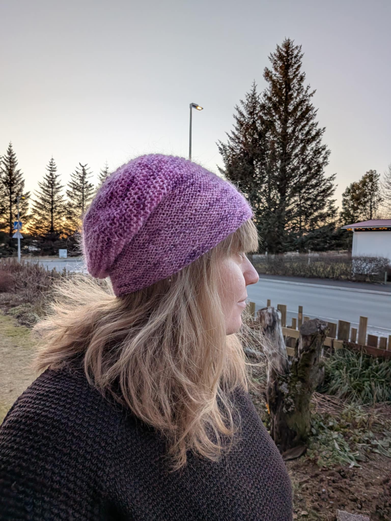Heiða knitted hat pattern shown as a soft Icelandic wool beanie worn outdoors in natural setting
