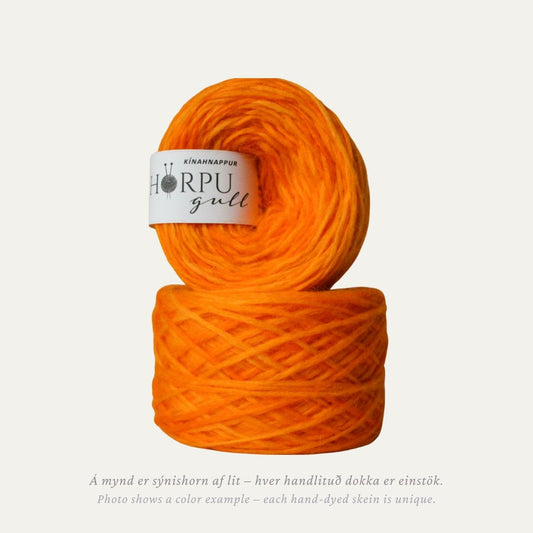 Hand-dyed Icelandic lopi yarn in bright warm orange tones inspired by globeflower