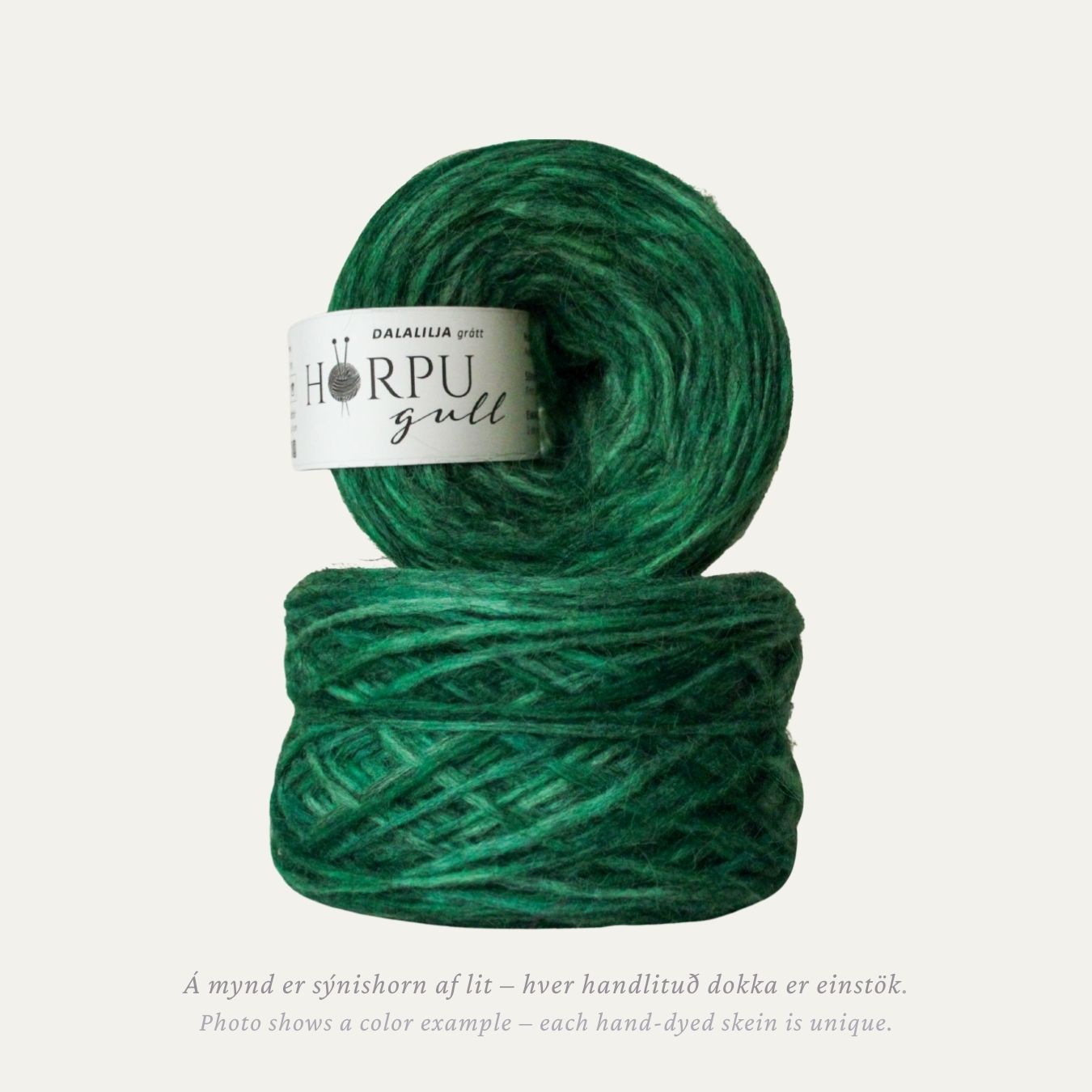 Hand-dyed Icelandic lopi yarn inspired by lily of the valley in deep green tones with a natural grey base