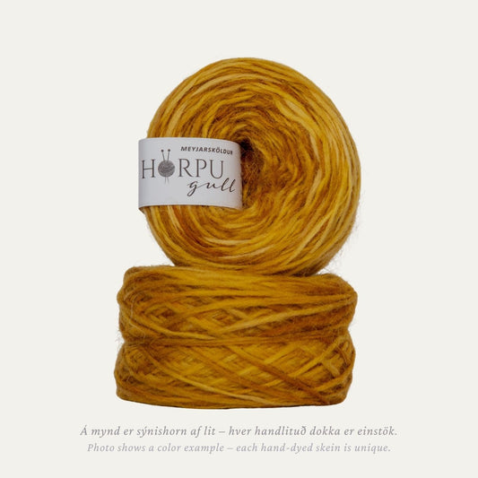 Hand-dyed Icelandic lopi yarn in warm golden earthy tones inspired by leopard plant