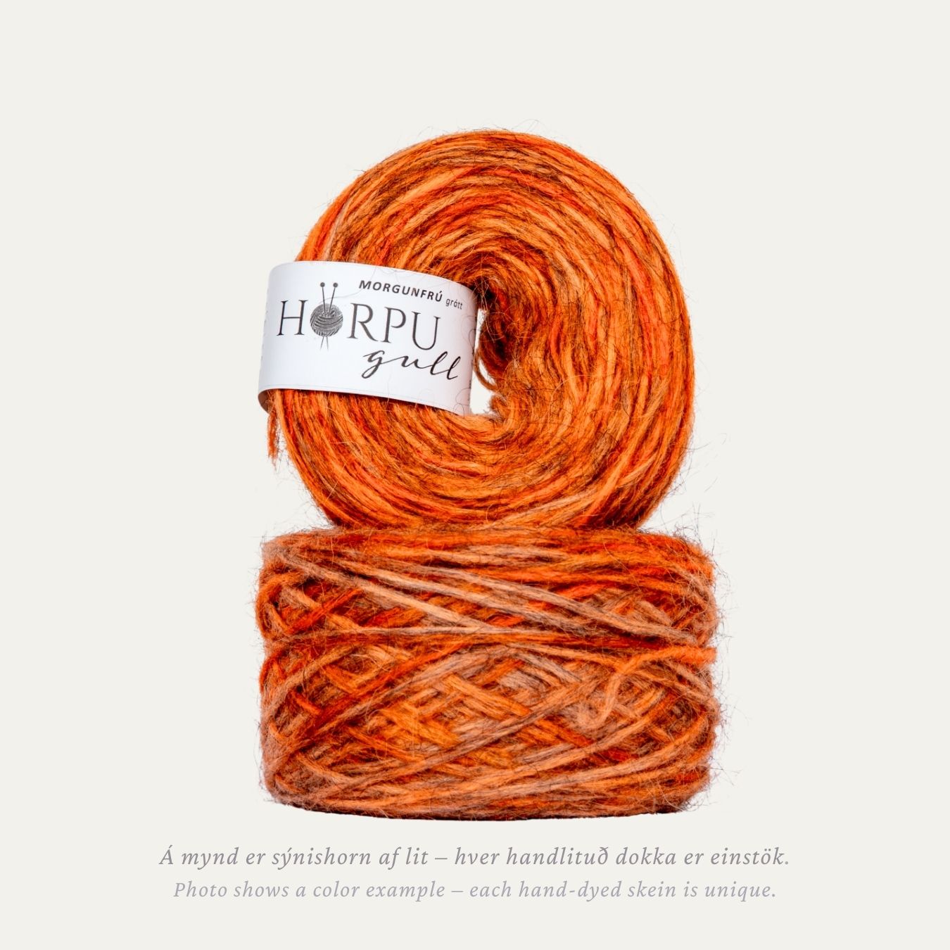 Morgunfrú hand-dyed Icelandic lopi yarn in warm orange tones dyed on natural grey wool base