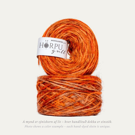 Morgunfrú hand-dyed Icelandic lopi yarn in warm orange tones dyed on natural grey wool base
