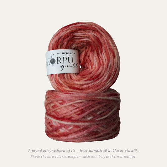 Hand-dyed Icelandic lopi yarn in soft dusty red tones inspired by red false goat’s beard