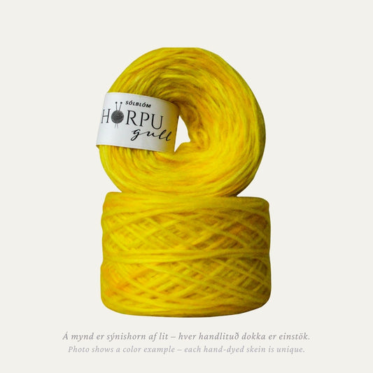 Hand-dyed Icelandic lopi yarn in bright sunflower yellow tones inspired by sunflower flowers